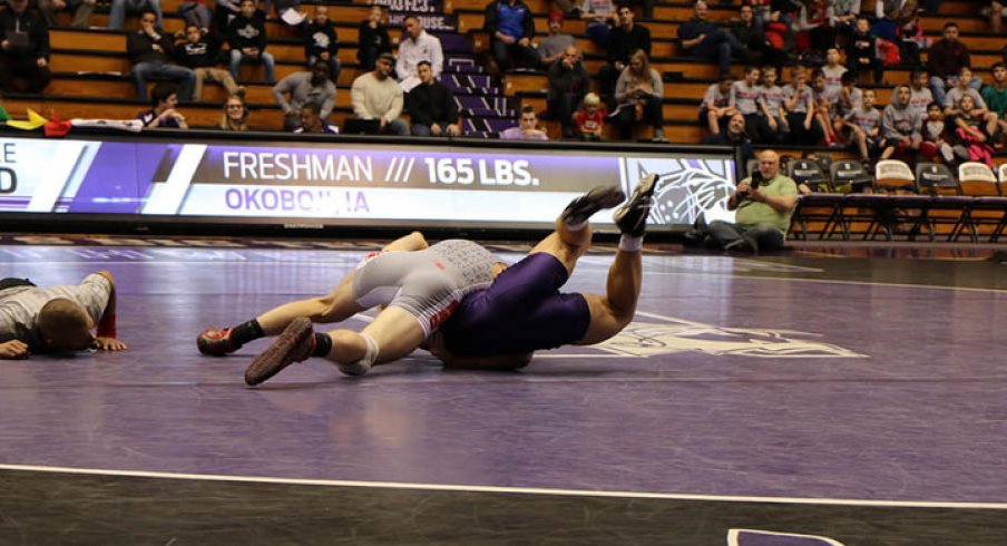 Bo Jordan records a pin at 165 against Northwestern.