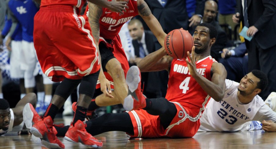 Daniel Giddens scrambles for a loose ball against Kentucky. 