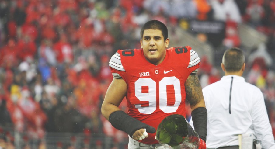 Tommy Schutt runs onto the field on Senior Day.