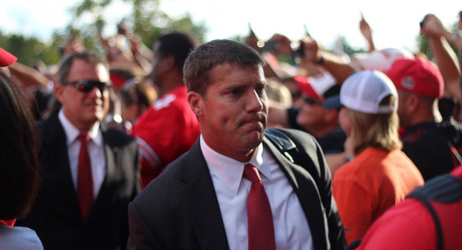 How Chris Ash is juggling two jobs in his final days at Ohio State.