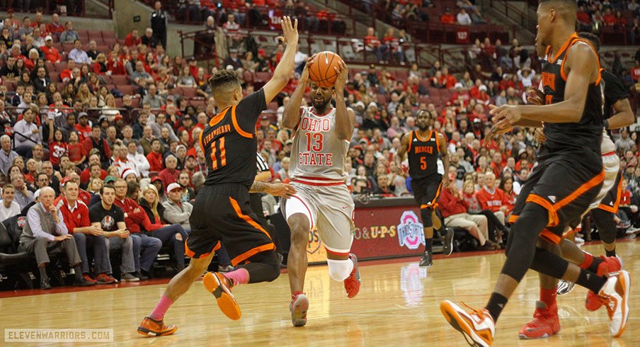 JaQuan Lyle drives inside against Mercer.