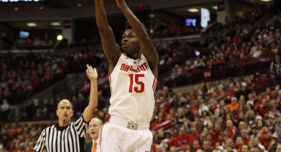 Kam Williams hoists a jumper against Illinois.