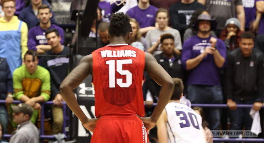 Kam Williams looks on as Northwestern shoots a free throw Wednesday night.