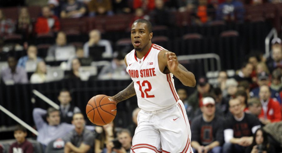 A.J. Harris brings the ball up the floor earlier this season.