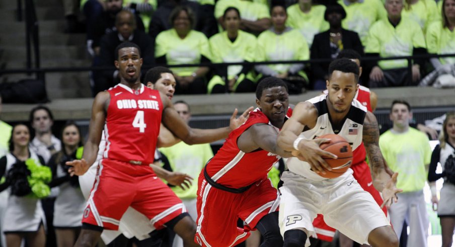 Jae'Sean Tate battles for a loose ball against Purdue.