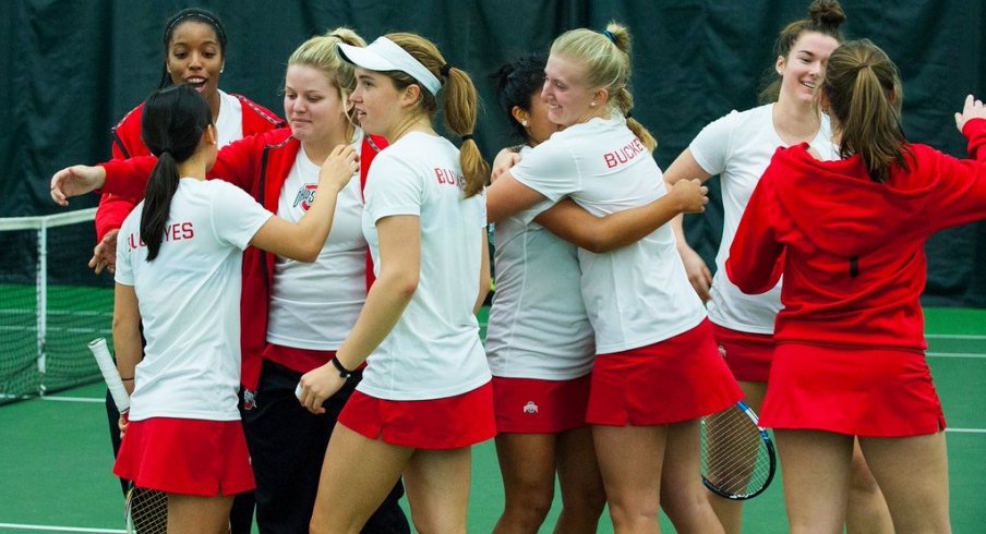 Women's tennis team celebrates victory over rival Michigan