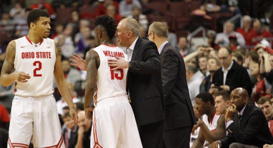 Thad Matta gives instructions to Marc Loving and Kam Williams.