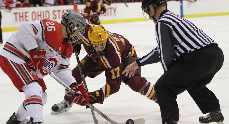 Ohio State's Mason Jobst faces off against Minnesota's Tommy Novak