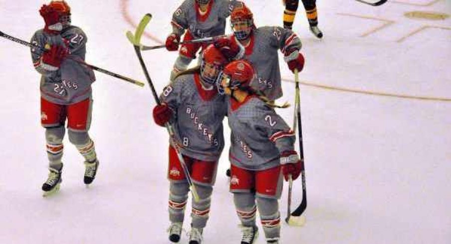 Ohio State women's hockey seniors Kendall Curtis and Cara Zubko skate off the ice.