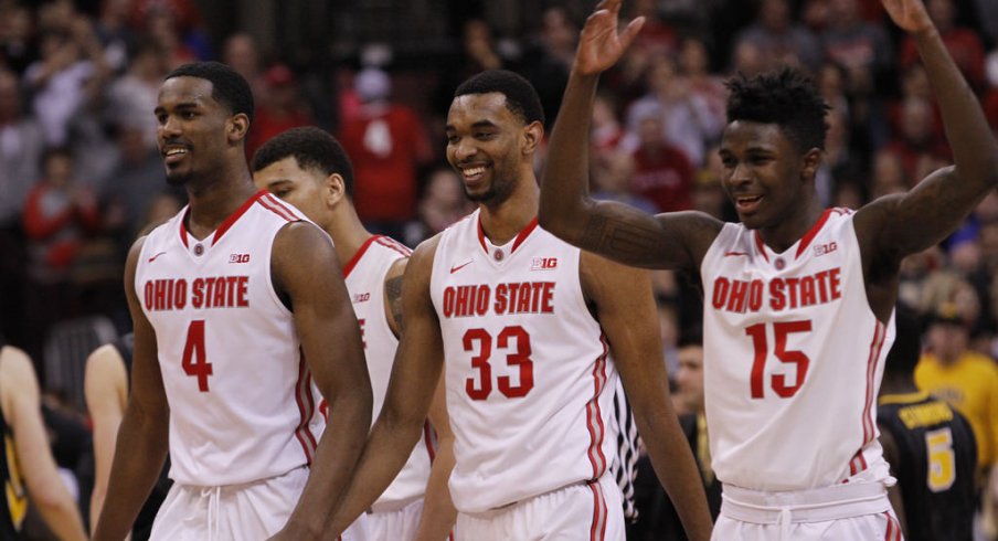 Daniel Giddens, Keita Bates-Diop and Kam Williams celebrate win over Iowa.