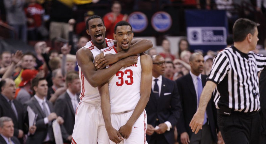 Daniel Giddens celebrates with Keita Bates-Diop after Ohio State beats Iowa.