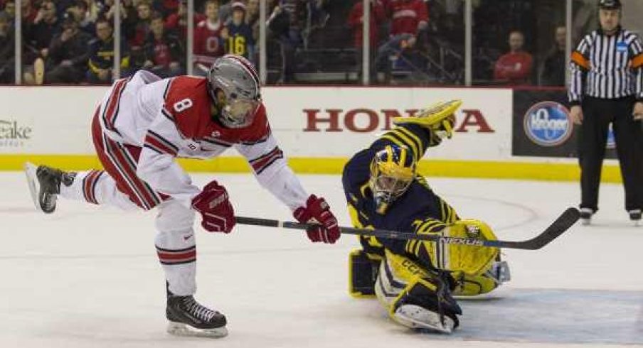 Ohio State forward Dakota Joshua wins the shootout with a goal against Michigan goalie Steve Racine.