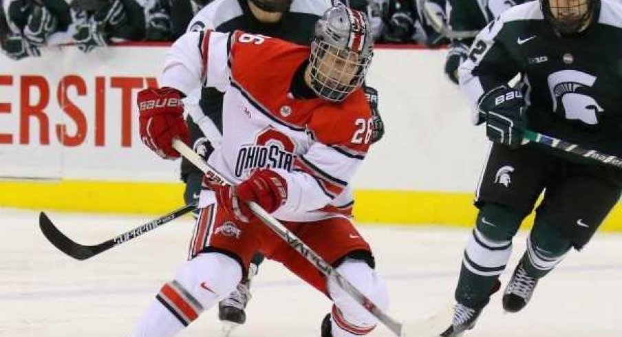 Ohio State forward Mason Jobst controls the puck against the Michigan State Spartans.