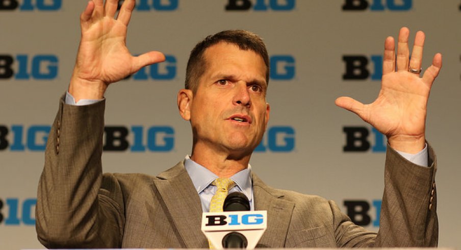 Jim Harbaugh takes a jab at Gene Smith