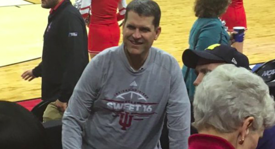 Jim Harbaugh dons Indiana shirt.