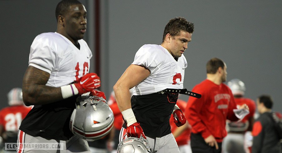 Sam Hubbard and Jaylyn Holmes during Ohio State's spring practice Tuesday.