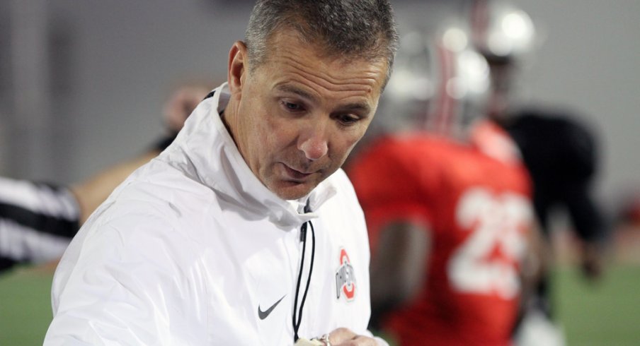 Urban Meyer addresses his team during spring practice.