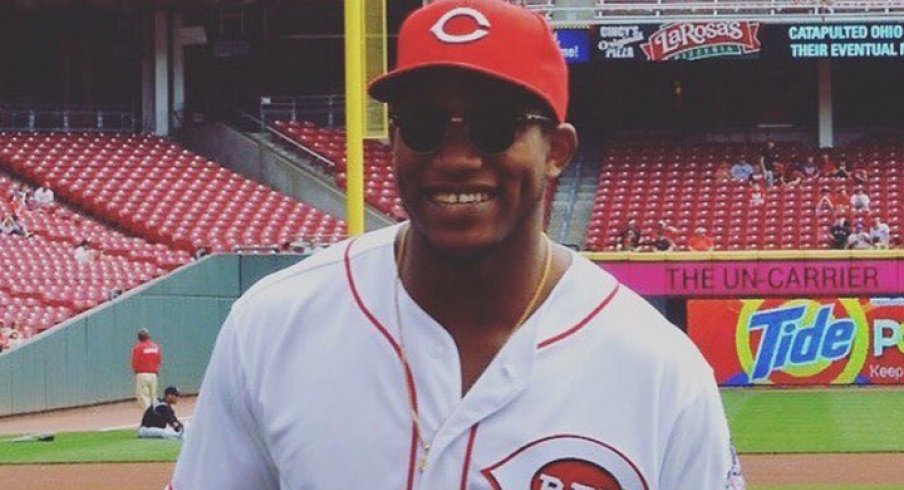 Darron Lee throws first pitch at Cincinnati Reds game.