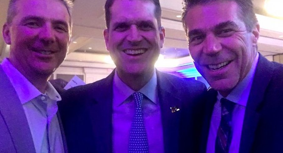 Jim Harbaugh and Urban Meyer posed for a selfie Friday night with Chris Fowler.