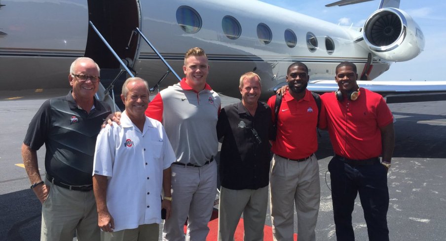 Ohio State captains and old men board flight to Chicago en route to Chicago.