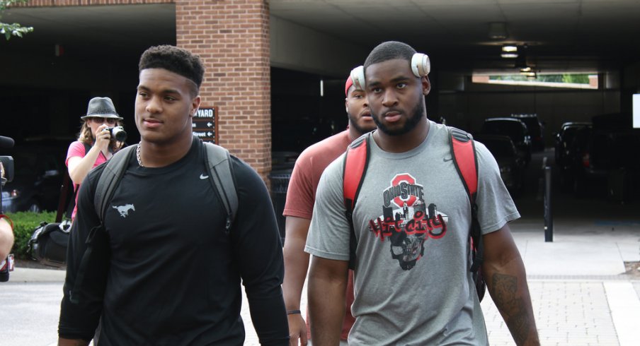 Dre'Mont Jones and Darius Slade check in for fall camp. 