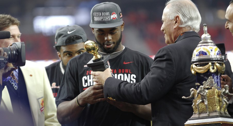 J.T. Barrett accepts his Fiesta Bowl MVP trophy.