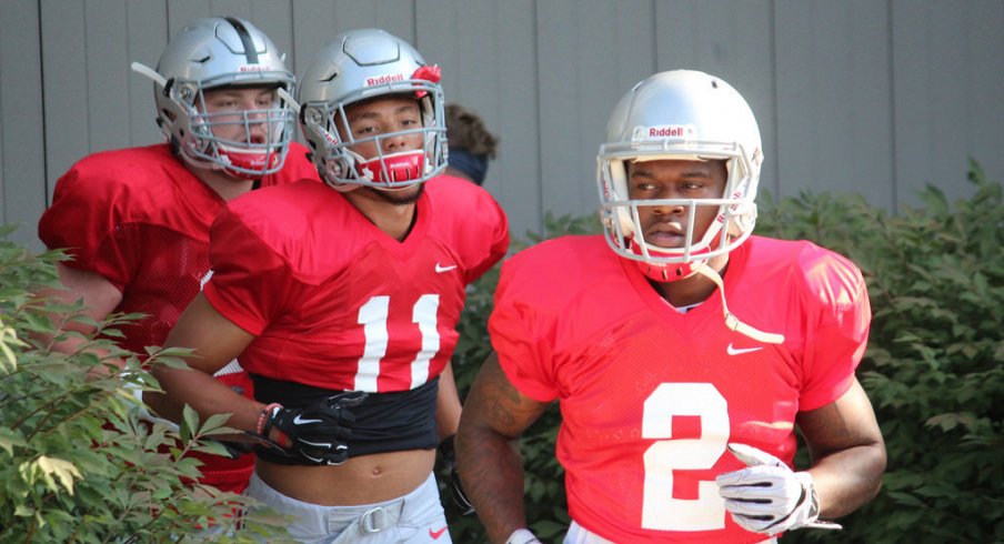 Dontre Wilson and Austin Mack take the practice field for Ohio State. 