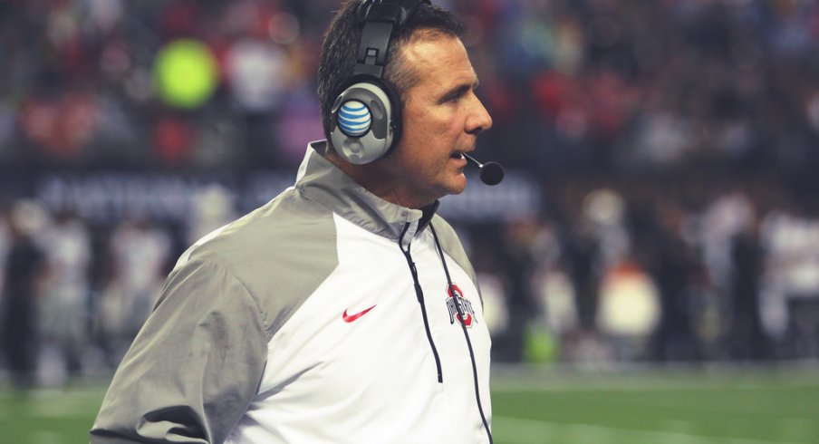 Urban Meyer strolls the sidelines.