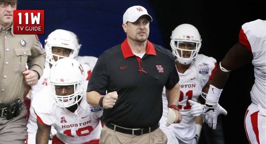 Tom Herman leads the Houston Cougars to the field for the Peach Bowl