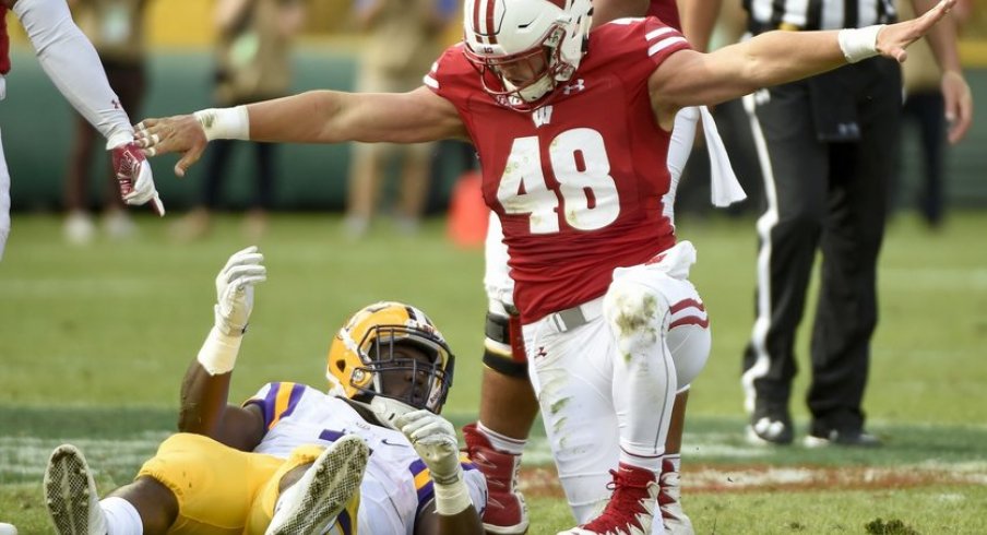 Sep 3, 2016; Green Bay, WI, USA; Wisconsin Badgers linebacker Jack Cichy (48) reacts after stopping LSU Tigers running back Leonard Fournette (7) short of a first down in the second quarter at Lambeau Field. Mandatory Credit: Benny Sieu-USA TODAY Sports