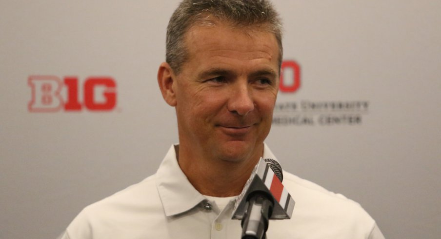 Urban Meyer at the podium. 