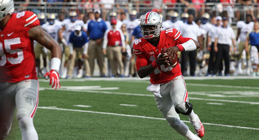 J.T. Barrett runs around for a short gain against Tulsa. 