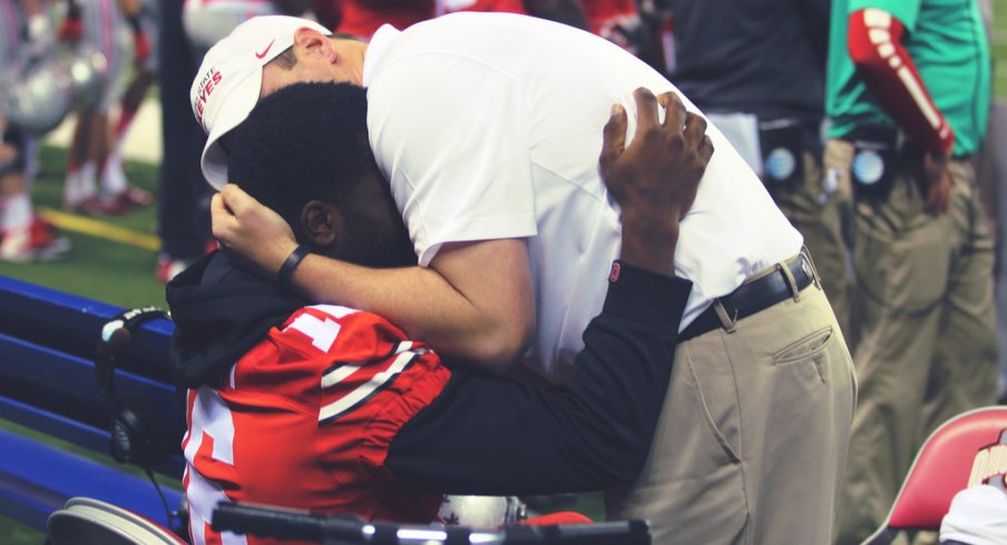 Tom Herman hugs J.T. Barrett before the Sugar Bowl. 