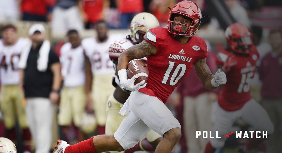 Sep 17, 2016; Louisville, KY, USA; Louisville Cardinals cornerback Jaire Alexander (10) looks back as he runs in a punt return for a touchdown against the Florida State Seminoles during the second half at Papa John's Cardinal Stadium. Louisville defeated Florida State 63-20. Mandatory Credit: Jamie Rhodes-USA TODAY Sports