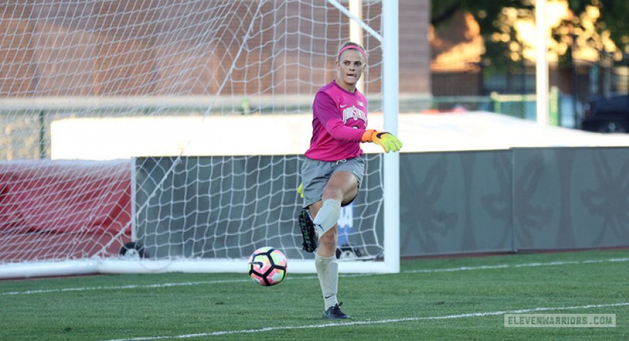 Jillian McVicker kicks a goal kick.