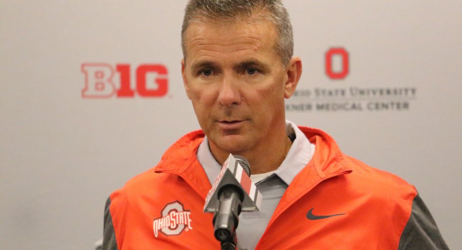 Urban Meyer addresses the media. 