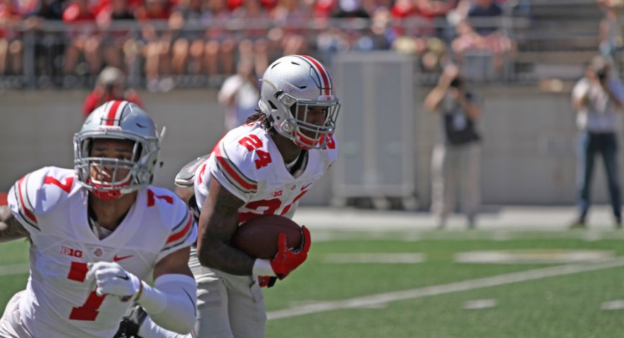 Damon Webb and Malik Hooker return an interception. 