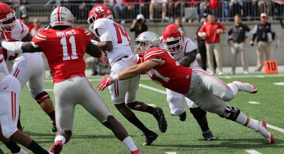 Nick Bosa, Jalyn Holmes get after the Rutgers quarterback. 