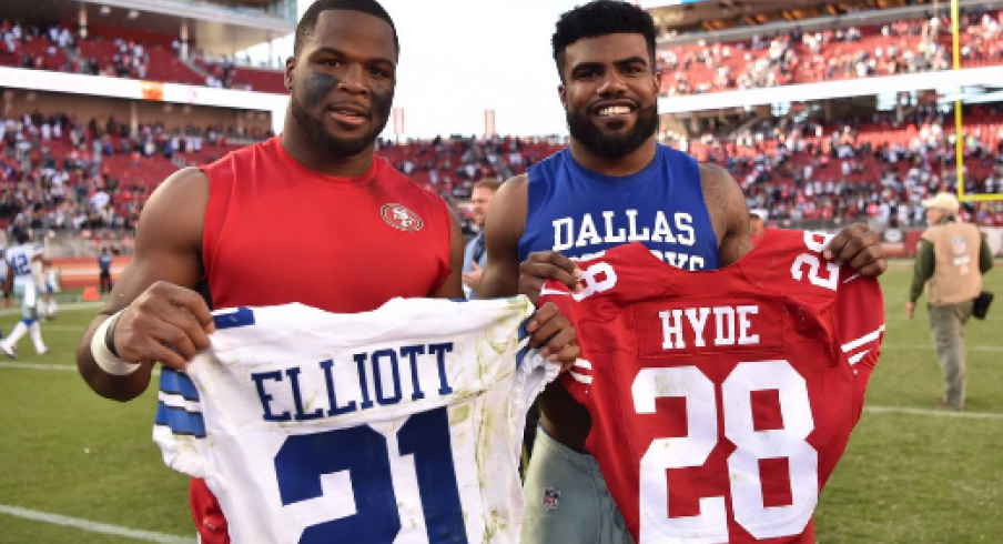 Guapo and Zeke trade jerseys.