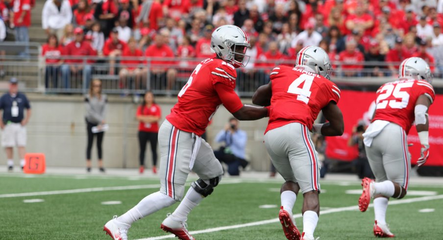 J.T. Barrett hands off to Curtis Samuel against Rutgers.