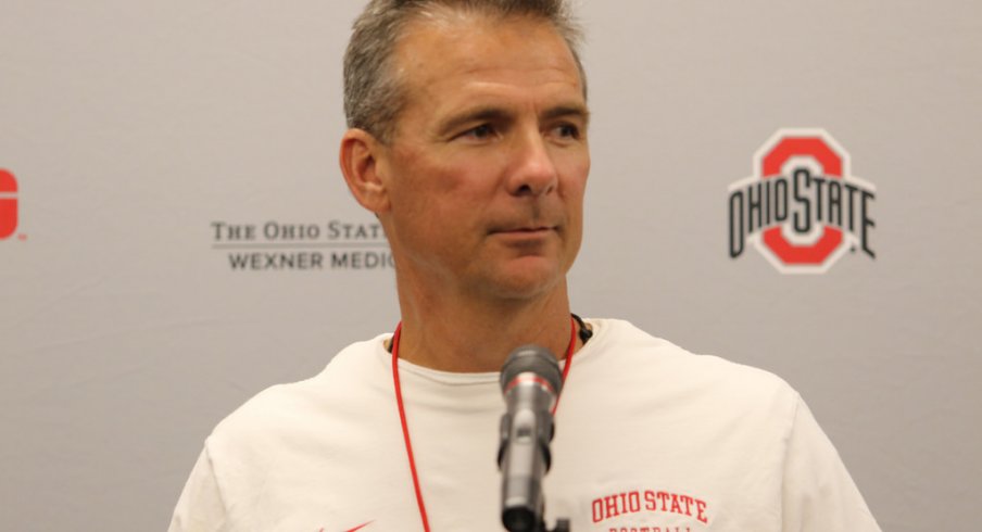 Urban Meyer talks to the media.