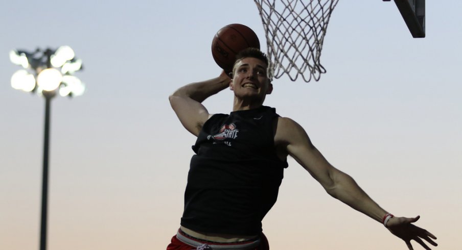 Ohio State freshman Micah Potter soars in warmups. 