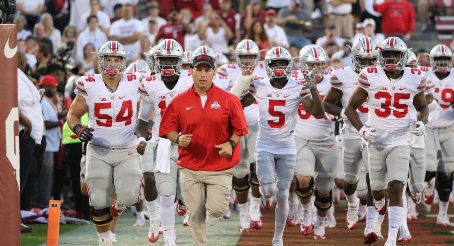 Ohio State players run onto the field at Oklahoma