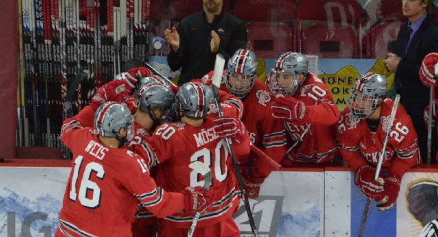 Ohio State men's hockey celebrates its win over Denver at the Ice Breaker Tournament.