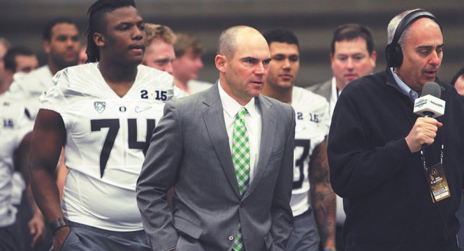 Oregon Coach Mark Helfrich leads his troops.