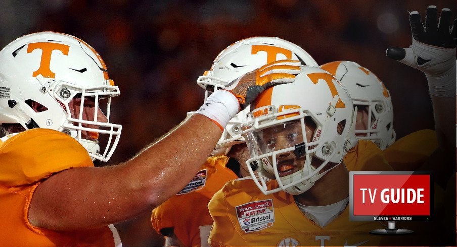 Sep 10, 2016; Bristol, TN, USA; Tennessee Volunteers quarterback Joshua Dobbs (11) celebrates scoring a touchdown against the Virginia Tech Hokies during the second quarter at Bristol Motor Speedway. Mandatory Credit: Peter Casey-USA TODAY Sports