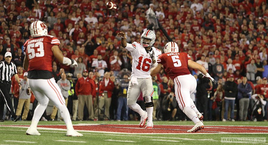 Ohio State quarterback J.T. Barrett lets go of a pass against Wisconsin. 