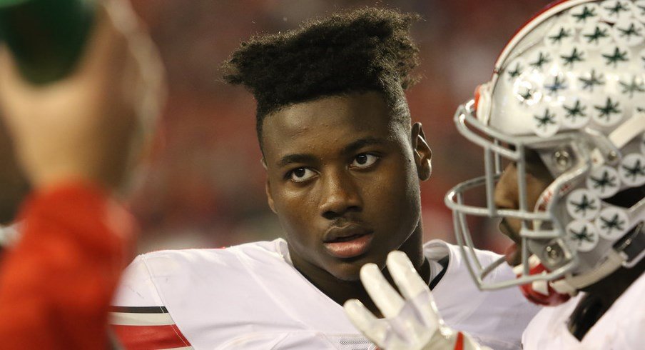 Curtis Samuel gets instructions from a coach during the Wisconsin game.