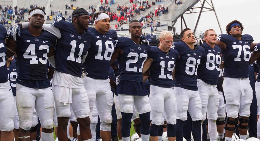 Penn State football players celebrate the team's win over Maryland.