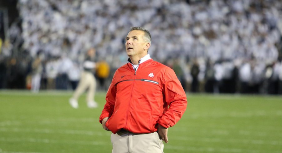 Urban Meyer gazes up at the Beaver Stadium scoreboard. 